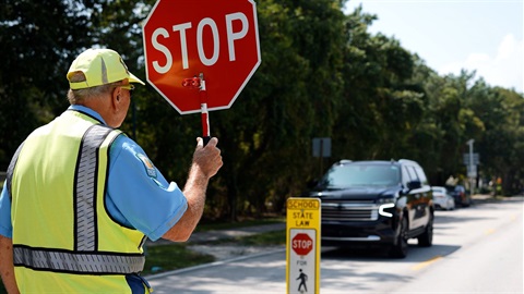 School Crossing Guard with sign 