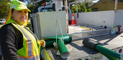 woman at green mast work site